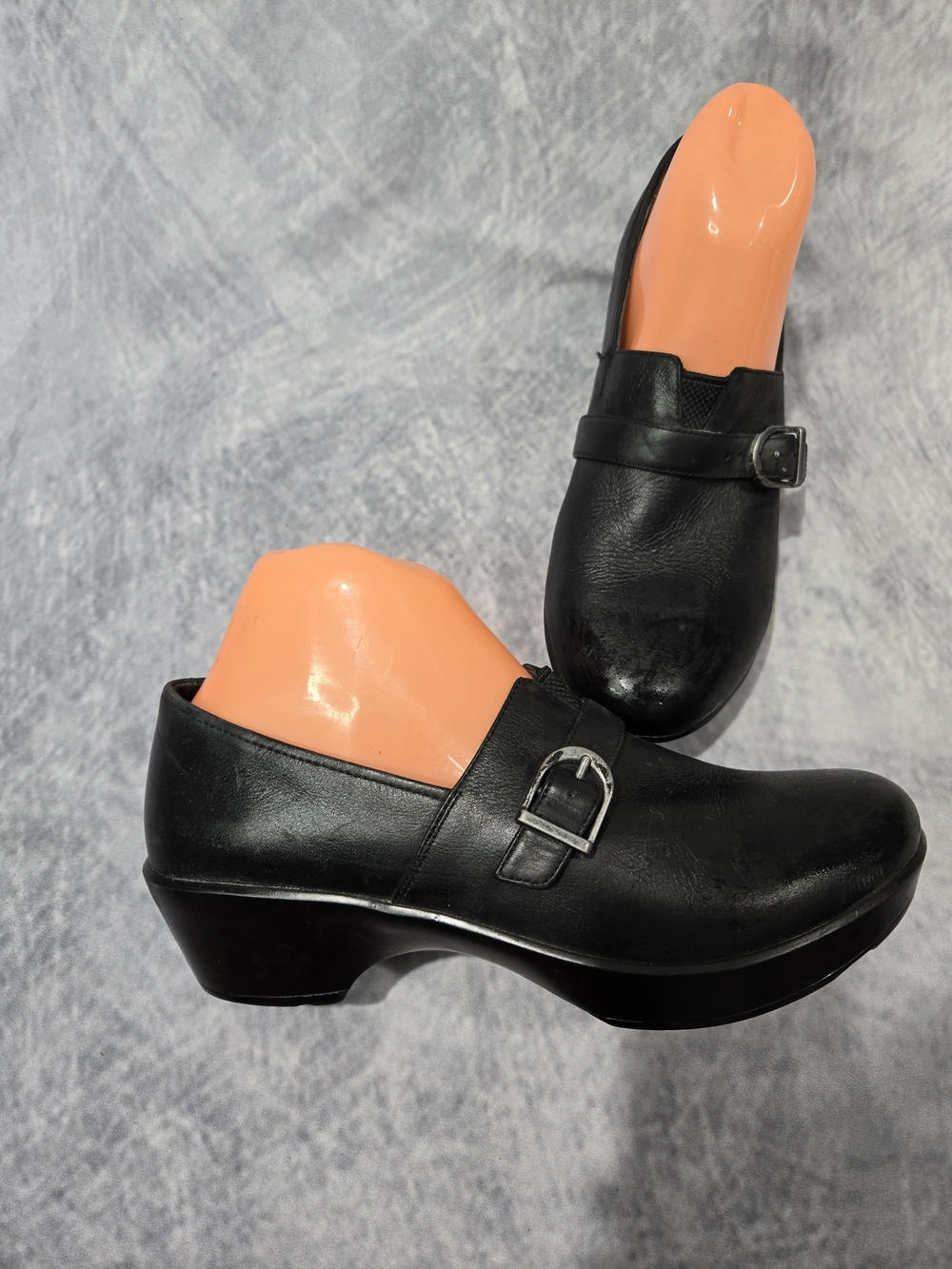 Dansko Women's black leather slip-on clogs, likely the 'Jane' or 'Tamara' style,